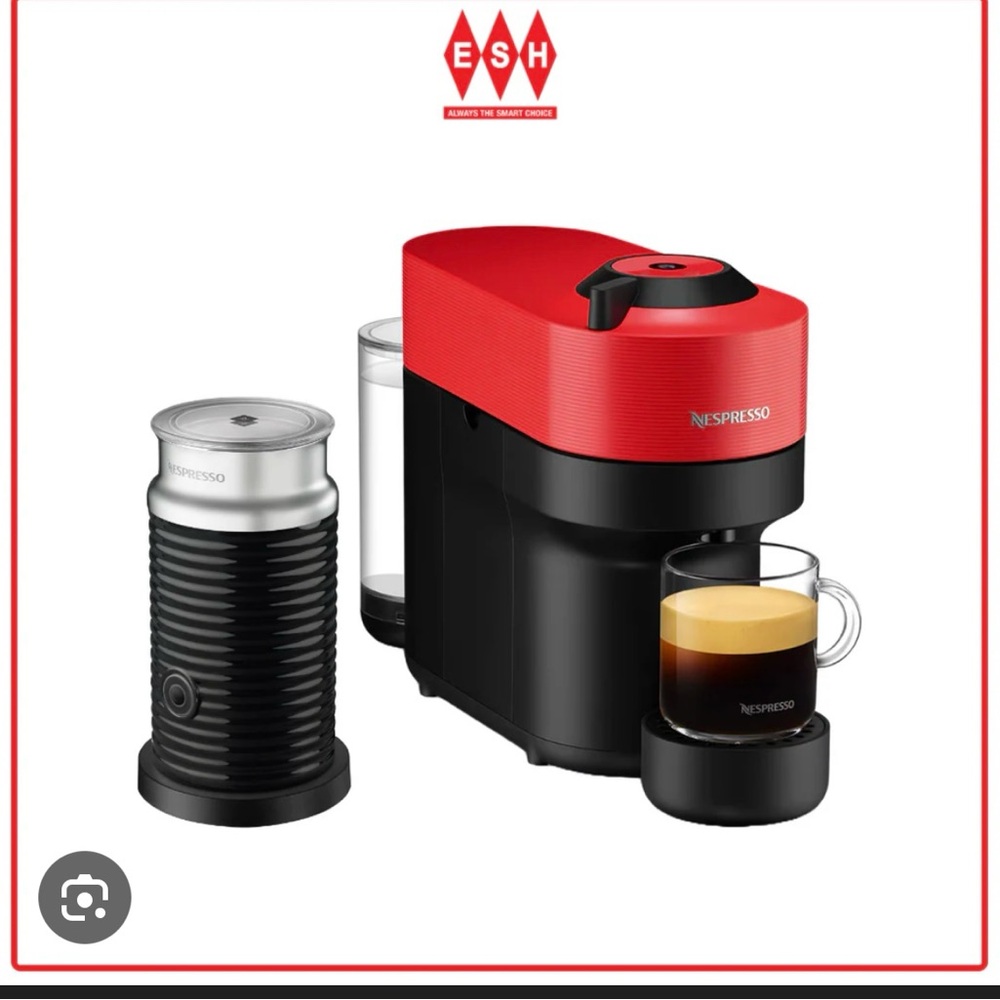 Nespresso Virtuo Pop, Red and Black Espresso Maker with attached milk frother.